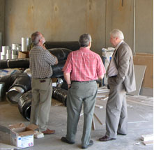 Stuart Altschuler, PFA, LLC confers with clients and contractors on new shop openings.